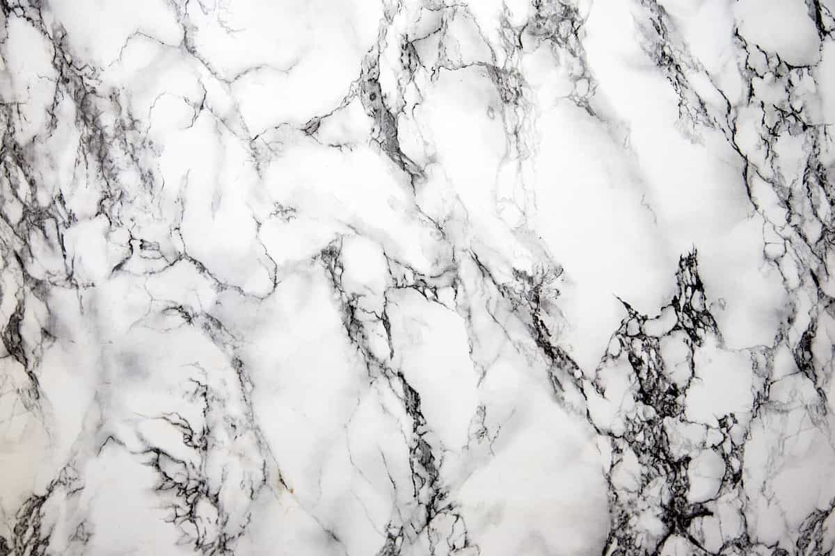  white marble tile with black veins in inddor uses 